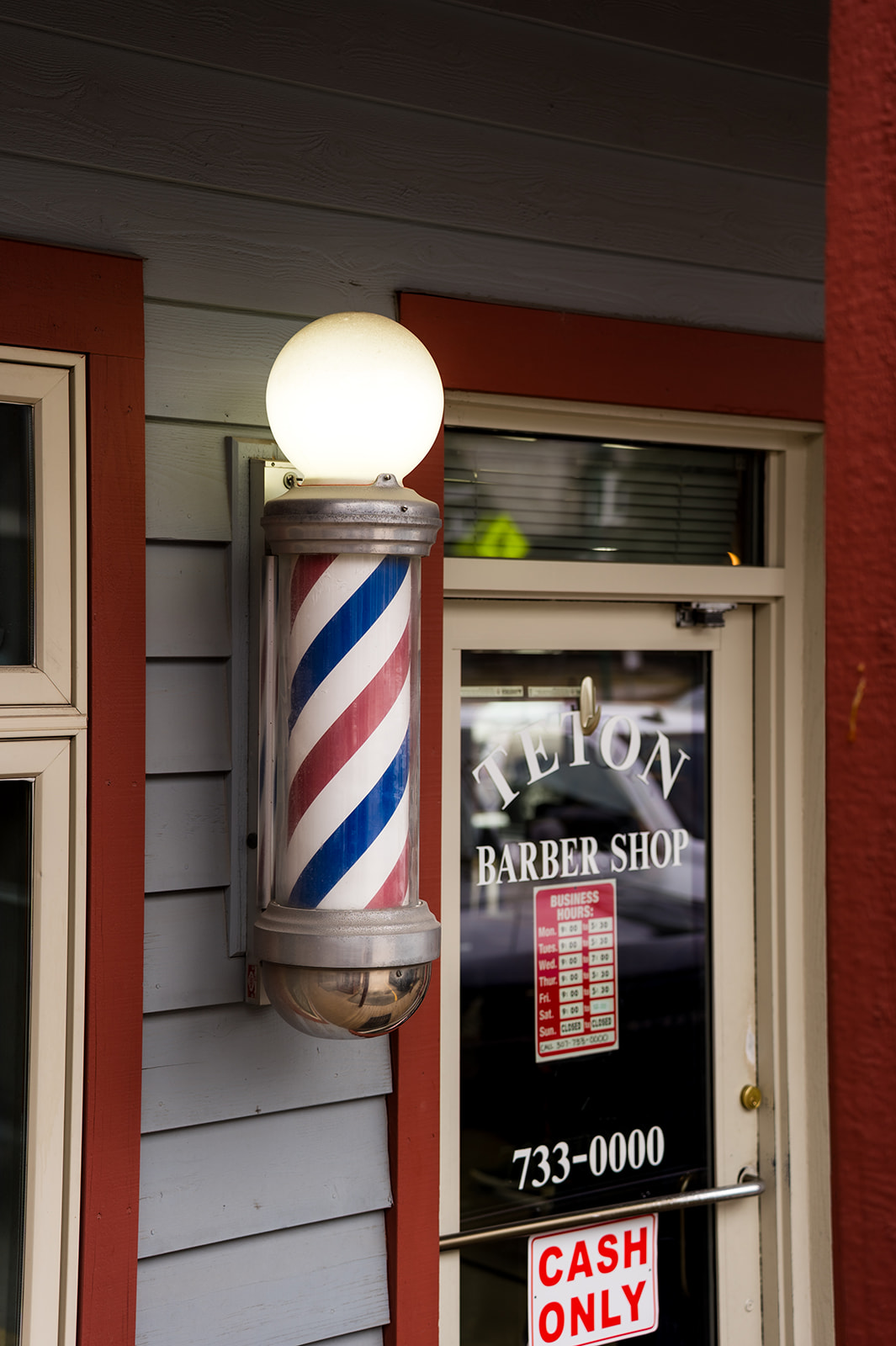 Close-up product photo of a barber pole