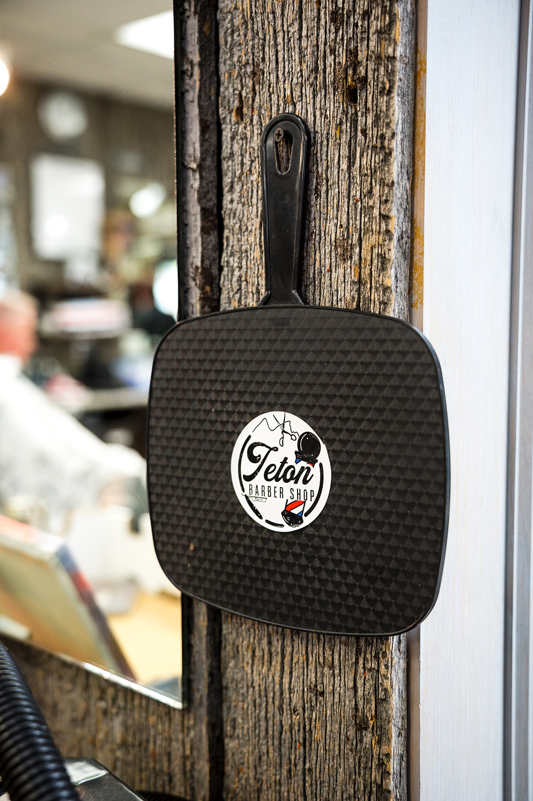 Branded shop logo on a hand mirror